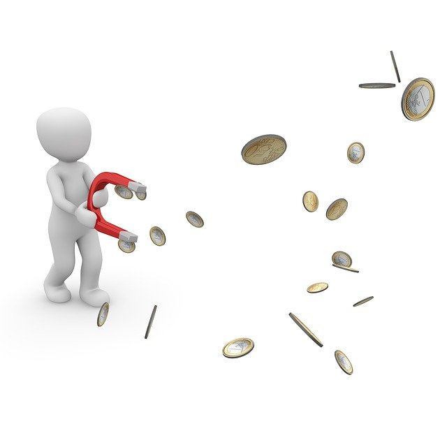 Figur zieht das Geld mit einem Magneten an.